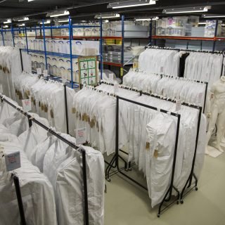 Rails of Tyvek garment bags at the Fashion Museum’s temporary accommodation at Dents in Warminster